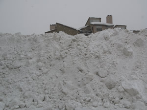 Snow keeps coming in wet wave after wave