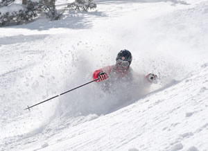 An unidentified Vail skier leans into a turn at Silverton Mountain, a one-lift wonder that provides more expert acreage than any other ski area in North America.