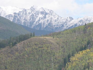 Picture this: snow on Breck's lifts, Vail's Gore Range