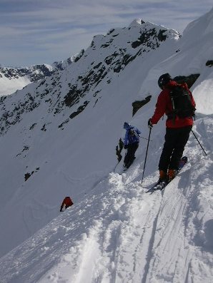 <strong>ON THE EDGE </strong>Skiers eye their line on a 40-degree pitch deep in the Chugach Mountains of Southeastern Alaska.