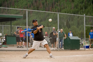 Joseph Alessi, Principal Trombone of the New York Philharmonic, swings for the fences in last year’s Town of Vail softball game.  