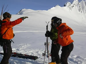 Alaska heli-skiing legend Dean Cummings, left, goes over some last-minute tips with clients who have gone to great lengths to reach the pinnacle of their sport.