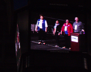 Democratic National Committee member Debbie Marquez, in red, is shown on the big screen during the Colorado National Convention Saturday, May 17. Marquez was later joined onstage by the entire Eagle County delegation, as well as others from around the state, as accepted her nomination in front of a crowd of approximately 10,000 at Colorado Springs' World Arena. 