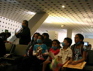 Waiting for flights in the airport in Mexico City, a place hard hit by the so-called swine flu virus.