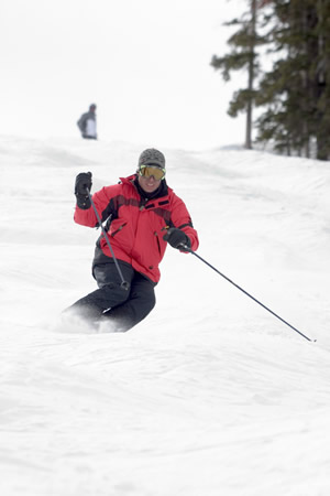 Three-time major winner Phil Mickelson, top background, watches the author take on a mogul line on Addy's run at Beaver Creek in 2005.