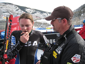 Vail's Lindsey Vonn, formerly Kildow, radios up to one of her teammates with a course report during downhill training Wednesday at Aspen. Vonn had the fastest time in training, and races for real on Friday.