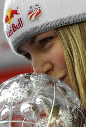 Vail's Lindsey Vonn, shown here sharing a close moment with the World Cup downhill globe, claimed 