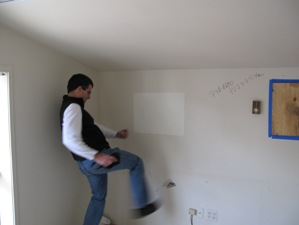 The author engages in some demolition of his own in the former editor's suite in the old Vail Daily offices in Crossroads.