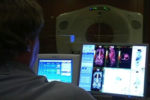 A radiologist at Shaw Regional Cancer Center examines a PET/CT scan.