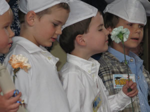 Max Williams, now 5, stops to smell the flowers during his Children's Garden of Learning graduation ceremony at Donovan Pavilion in Vail in June. 