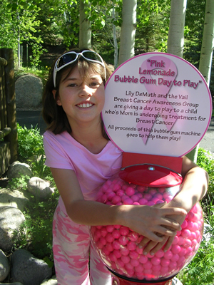 Lily DeMuth, 8, of Edwards, is raising money for breast cancer awareness with a bubble-gum machine she found abandoned in her mother's office.