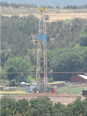 Oil rigs dot the horizon in Garfield County on the way to Grand Junction, but a new study finds the recent boom does not contribute as much to the state's economy as other industry.