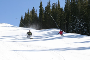 Skiers offer a preview of Copper Mountain's Nov. 7 opening with some fresh tracks down Copperopolis trail.