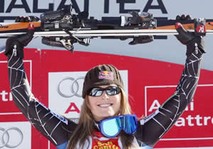 Ski Club Vail product Lindsey Vonn, 23, celebrates a downhill win Saturday on the men's speed course used during the 2006 Winter Olympics in Sestriere, Italy.